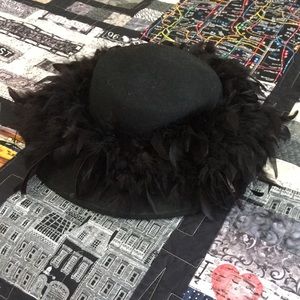 Black wool felt hat with feather embellishment